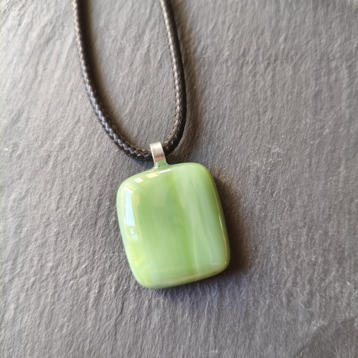 Handcrafted fused green glass pendant with cord necklace
