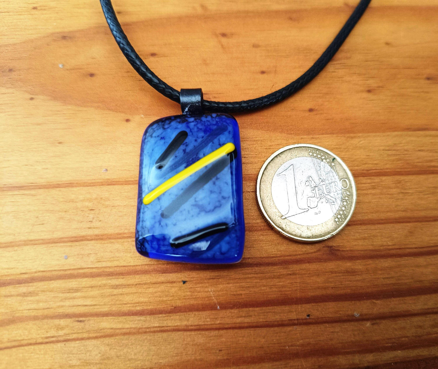 blue black and yellow fused glass necklace handmade with cord with a coin