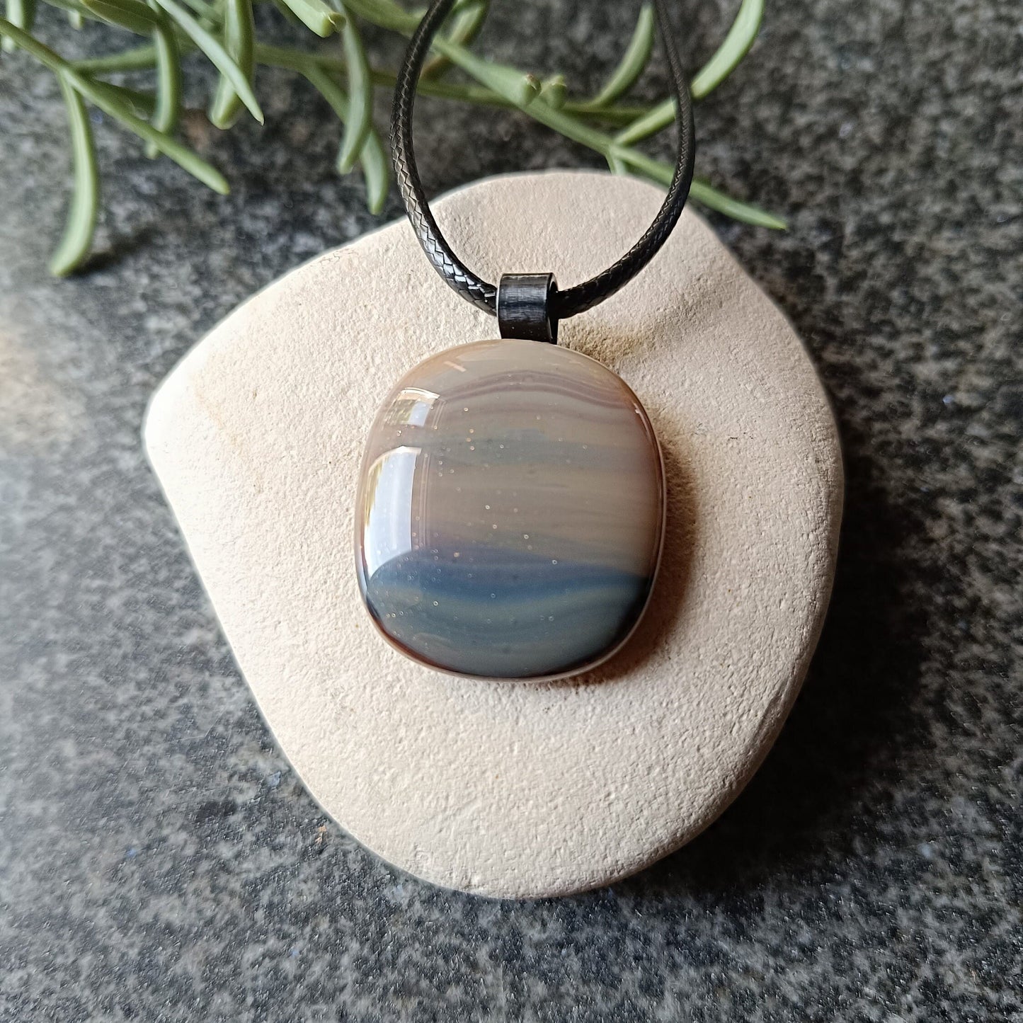glass pendant on cord, natural colours