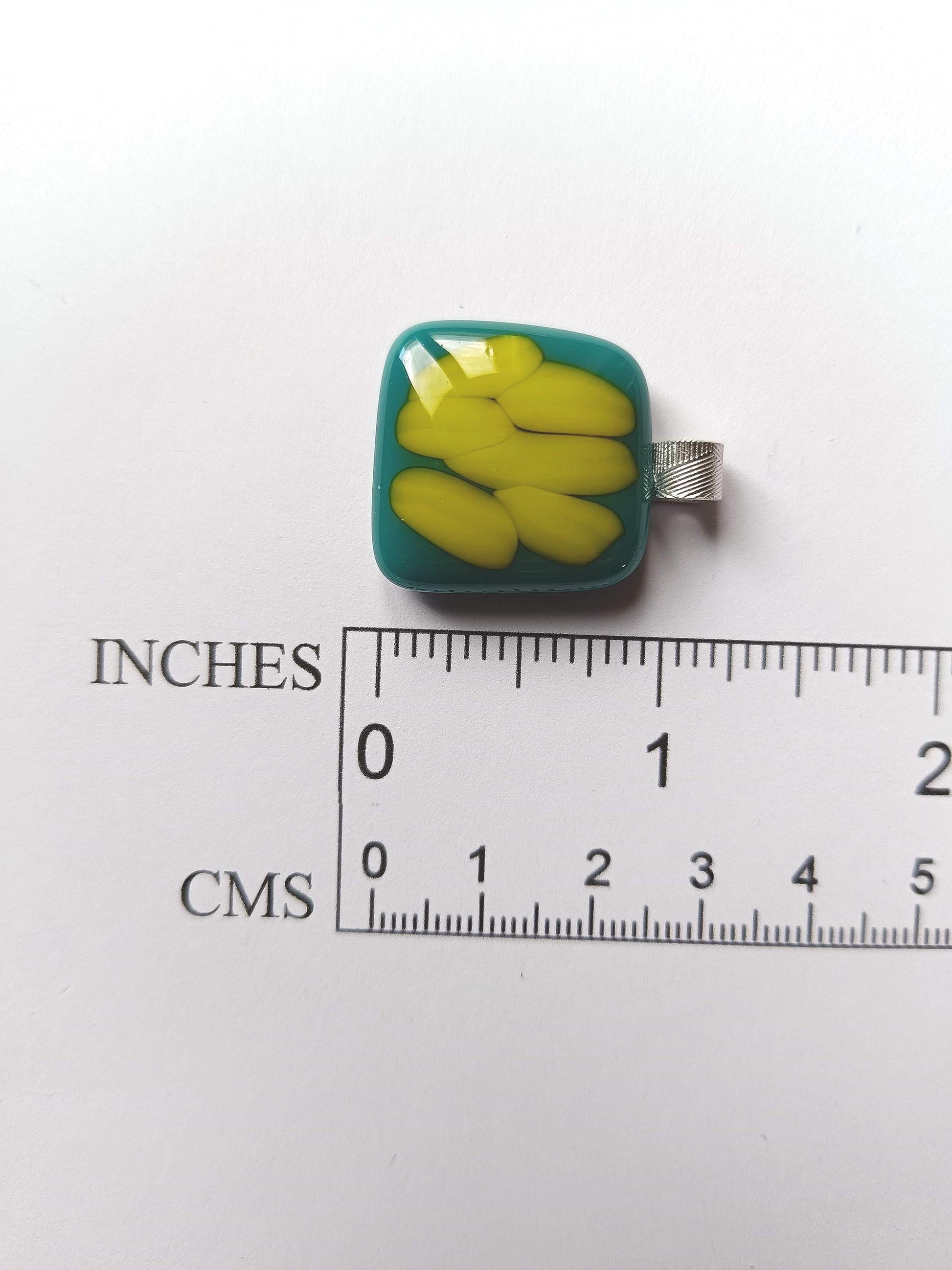 Teal fused glass pendant on a silver cord necklace; turquoise blue glass with yellow shapes, handmade, gender-neutral gift.