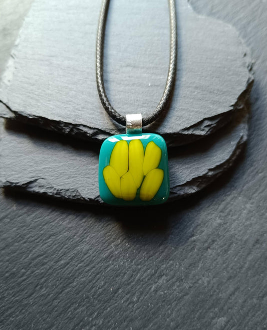 Teal fused glass pendant on a silver cord necklace; turquoise blue glass with yellow shapes, handmade, gender-neutral gift.