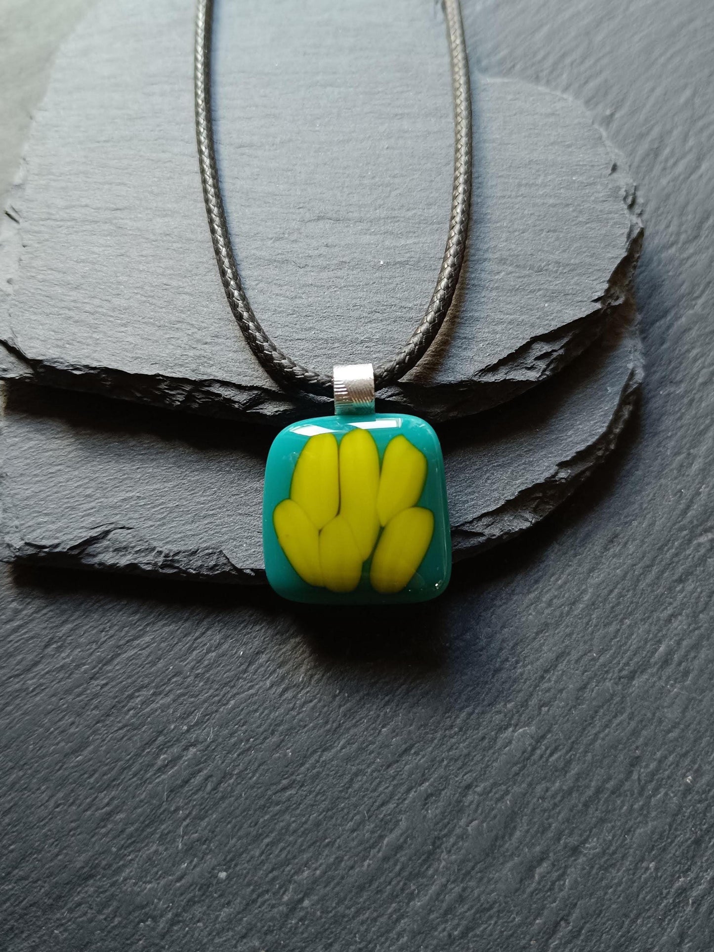 Teal fused glass pendant on a silver cord necklace; turquoise blue glass with yellow shapes, handmade, gender-neutral gift.