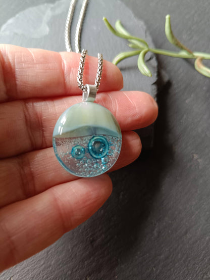 Blue bubble necklace: round fused glass pendant with aqua gradient and bubbles on a silver chain; one-of-a-kind handmade jewellery.