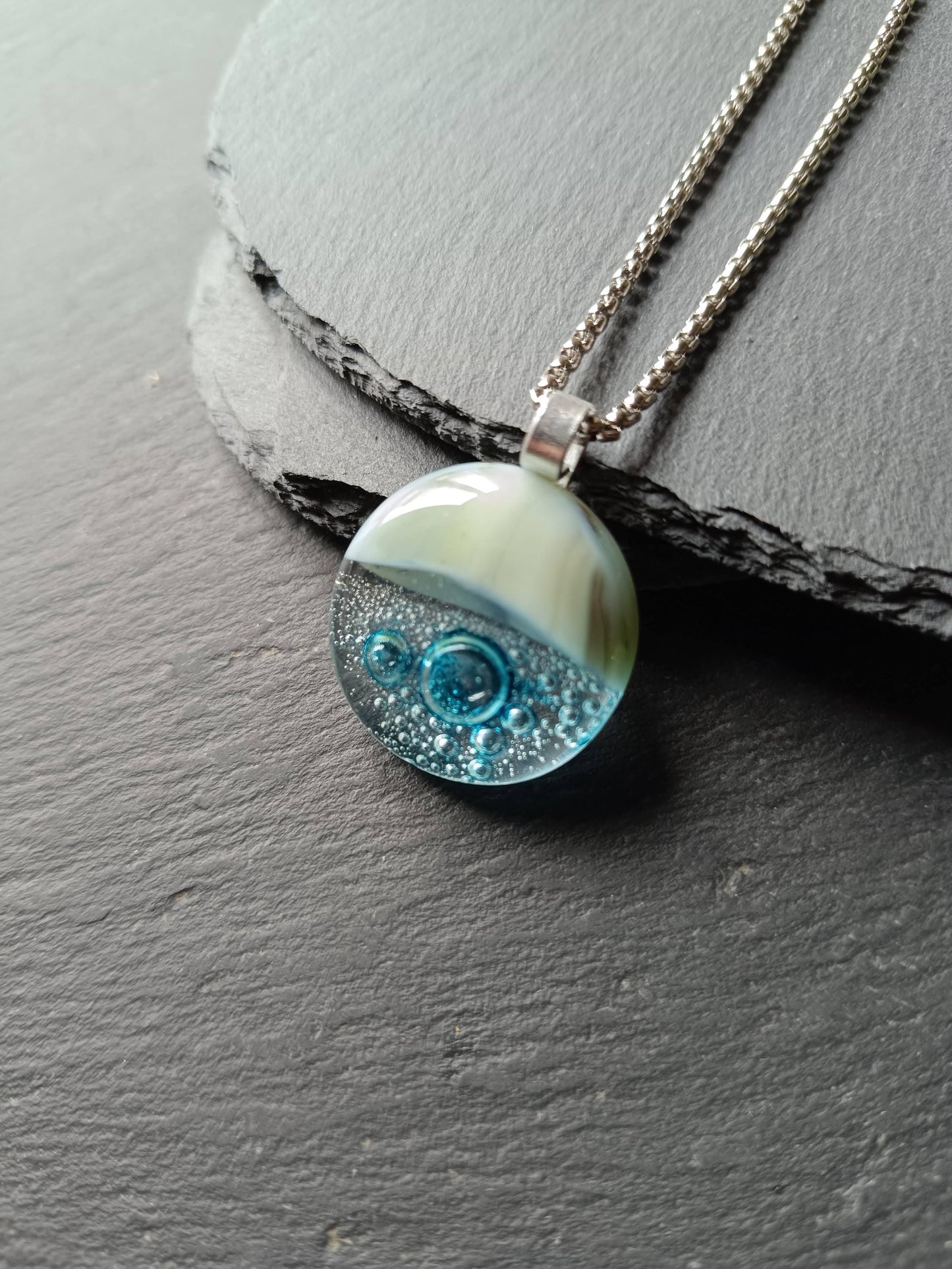 Blue bubble necklace: round fused glass pendant with aqua gradient and bubbles on a silver chain; one-of-a-kind handmade jewellery.