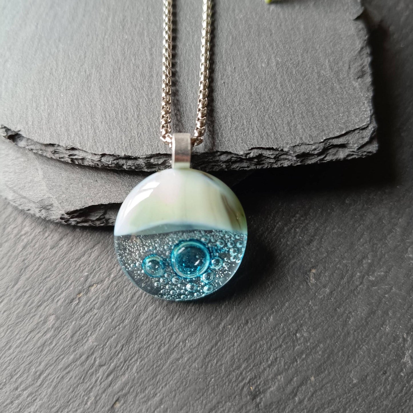 Blue bubble necklace: round fused glass pendant with aqua gradient and bubbles on a silver chain; one-of-a-kind handmade jewellery.