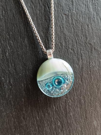Blue bubble necklace: round fused glass pendant with aqua gradient and bubbles on a silver chain; one-of-a-kind handmade jewellery.