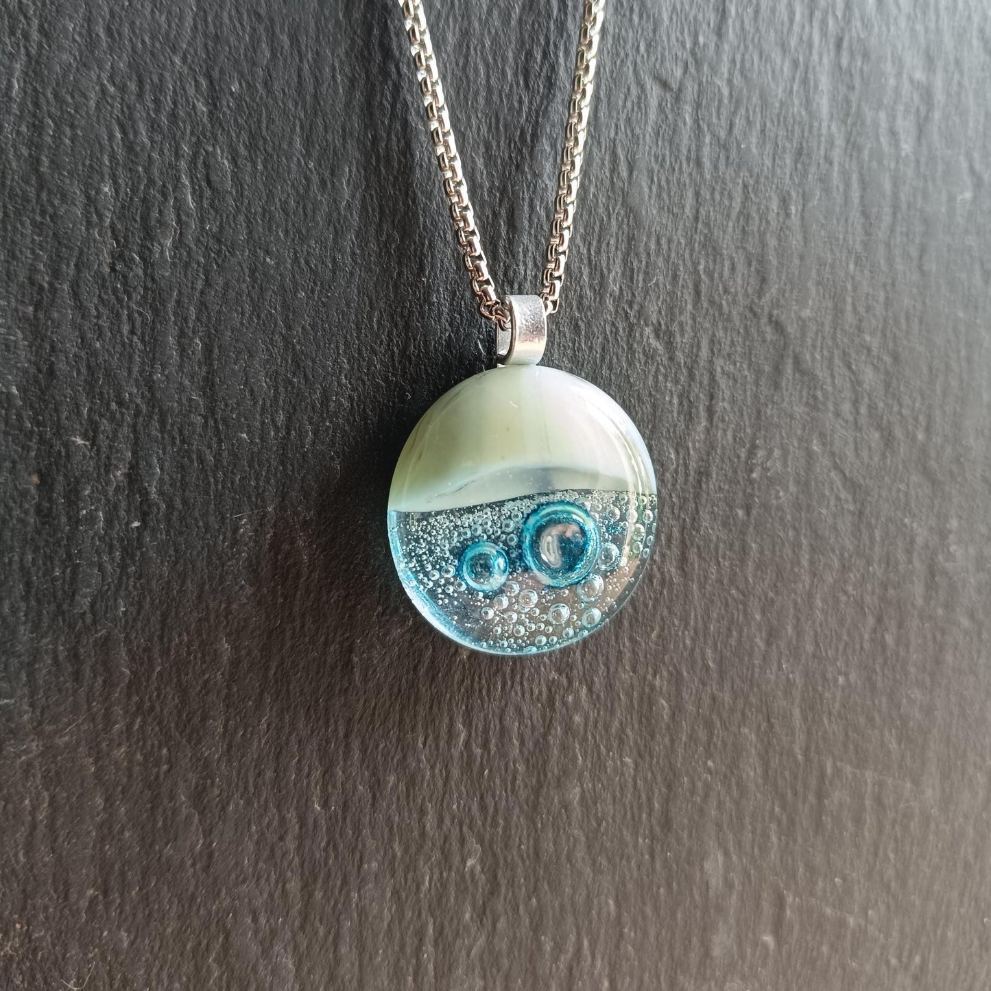 Blue bubble necklace: round fused glass pendant with aqua gradient and bubbles on a silver chain; one-of-a-kind handmade jewellery.