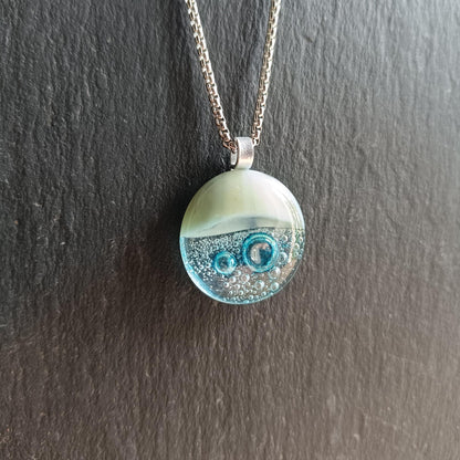 Blue bubble necklace: round fused glass pendant with aqua gradient and bubbles on a silver chain; one-of-a-kind handmade jewellery.