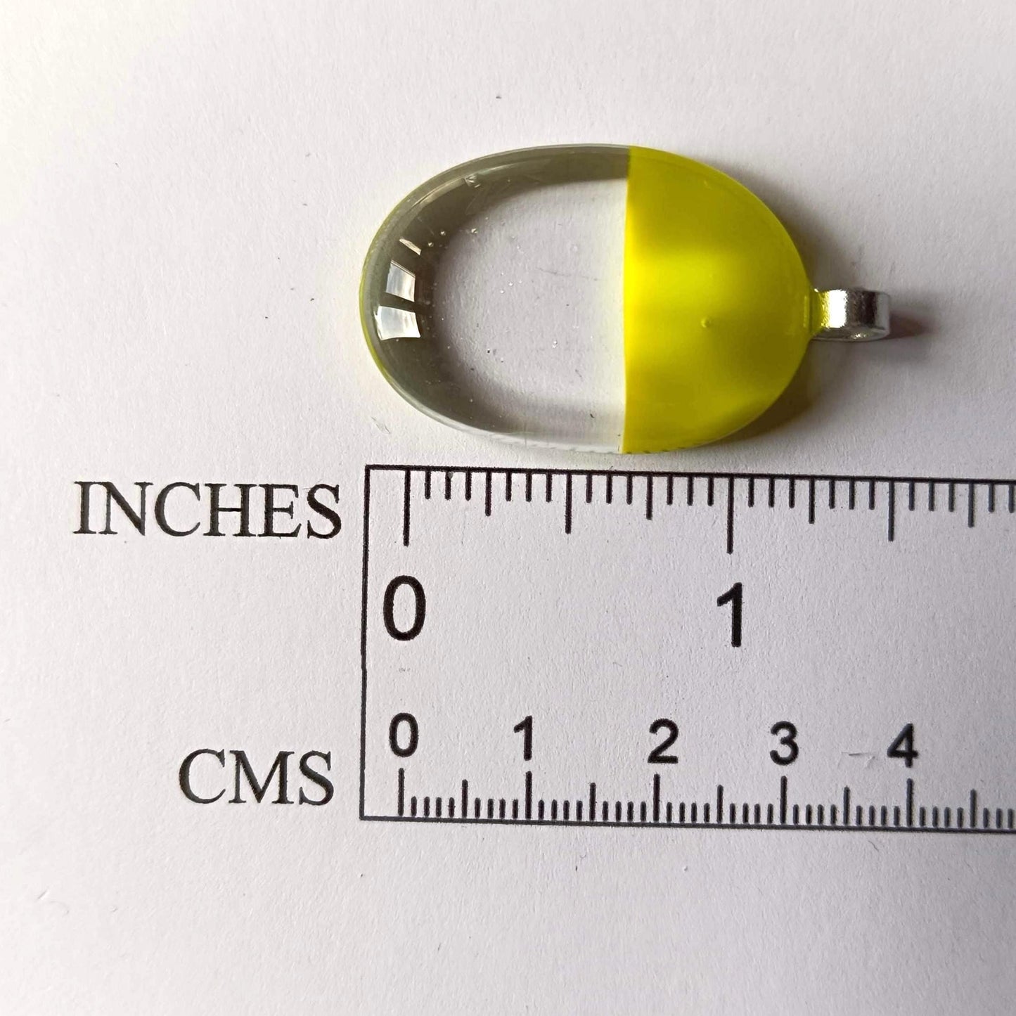 Handcrafted lime green and clear fused glass oval pendant necklace on a silver chain.