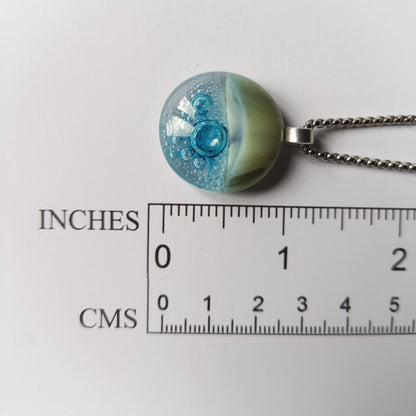 Blue bubble necklace: round fused glass pendant with aqua gradient and bubbles on a silver chain; one-of-a-kind handmade jewellery.
