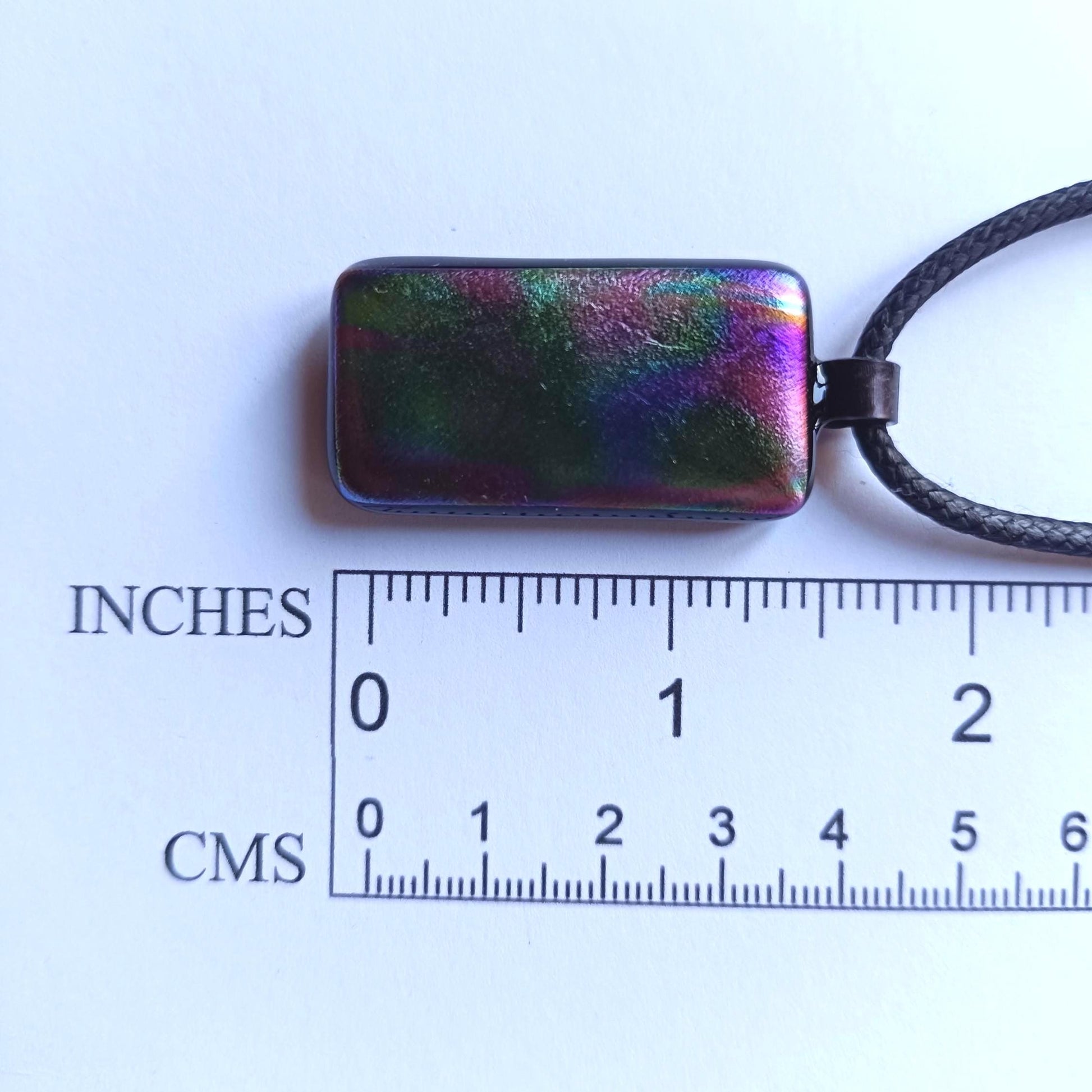 Dichroic fused glass pendant on black cord necklace; rainbow necklace with iridescent hues; artisan handmade jewellery gift.