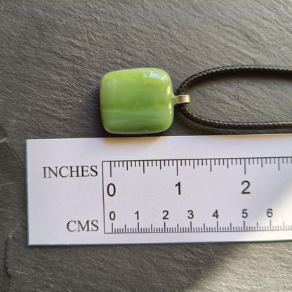 Handcrafted fused green glass pendant with cord necklace
