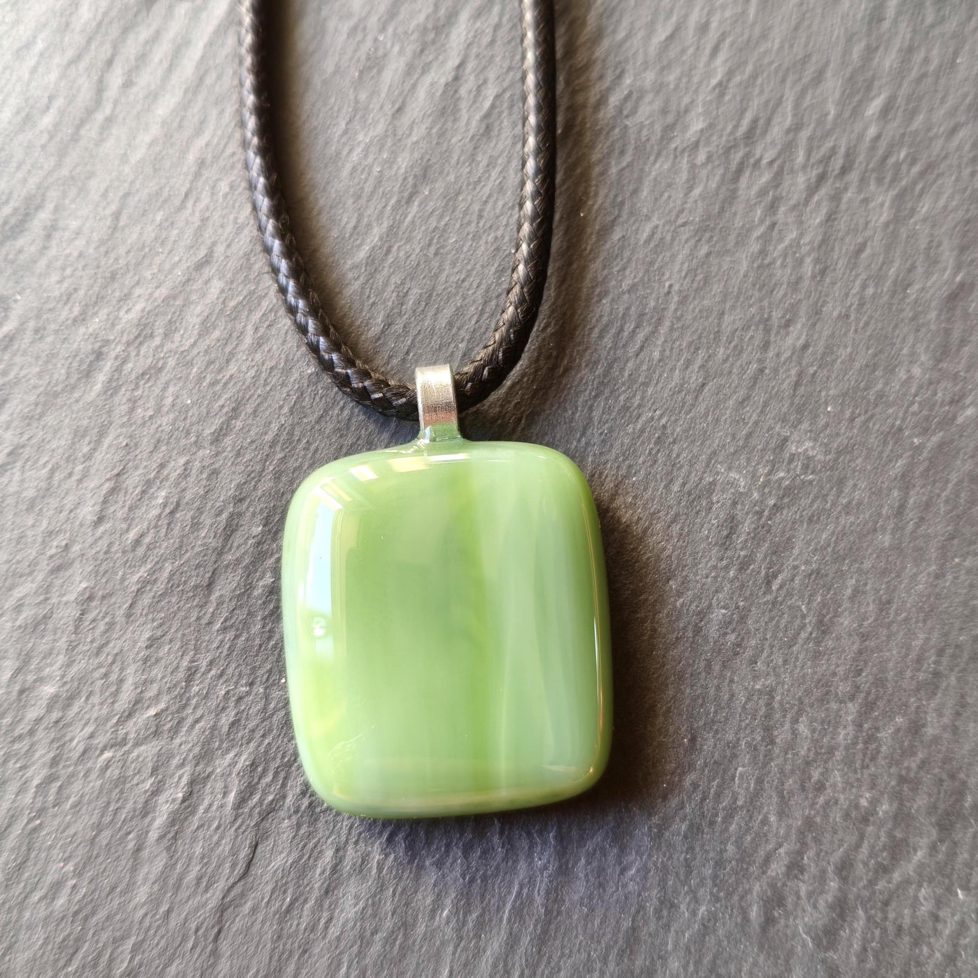 Handcrafted fused green glass pendant with cord necklace