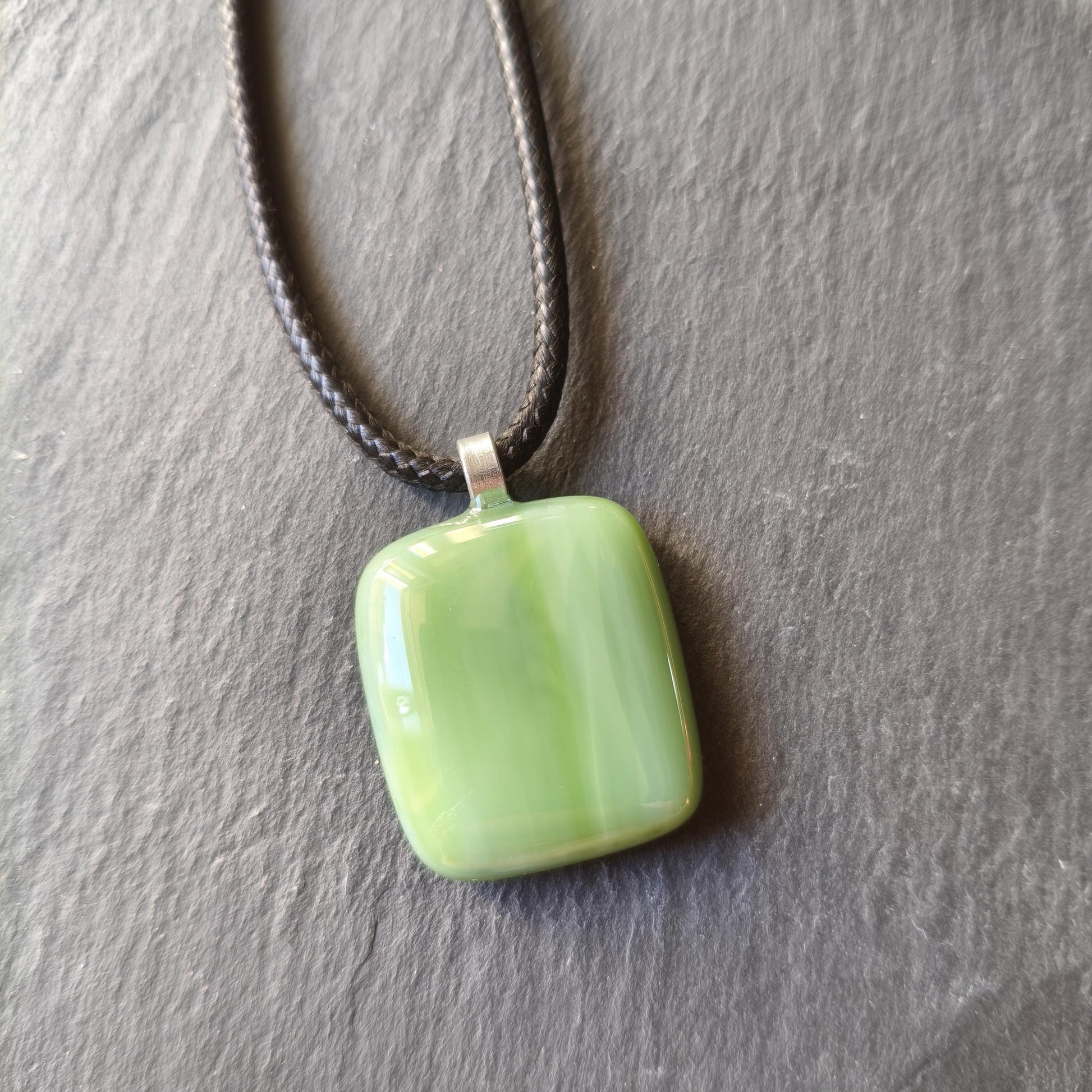 Handcrafted fused green glass pendant with cord necklace