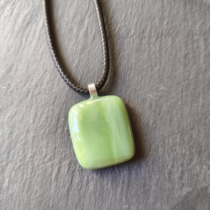 Handcrafted fused green glass pendant with cord necklace