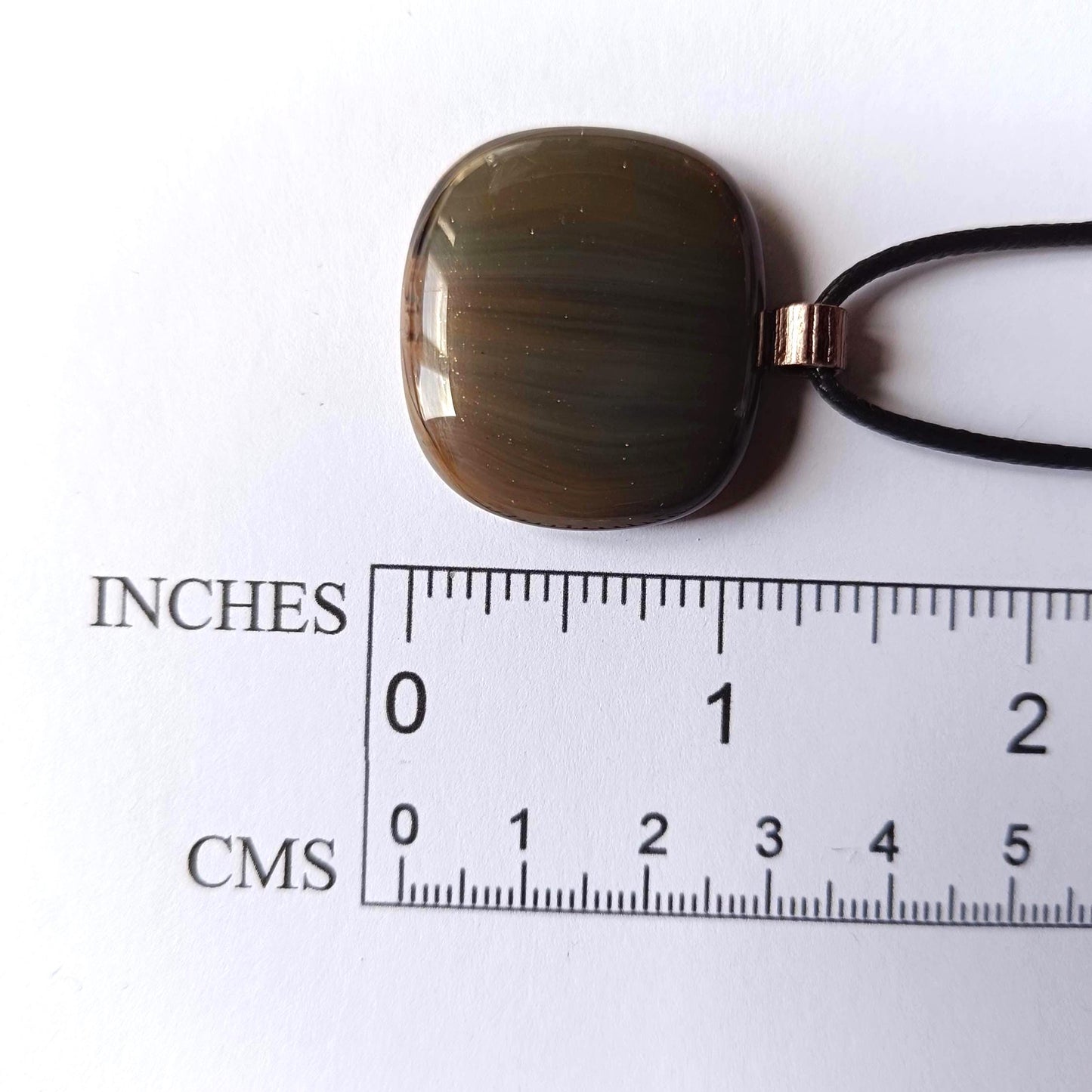 Fused glass pendant necklace with blue-green striped pendant, copper bail on black cord—artisan handmade jewellery, gift.