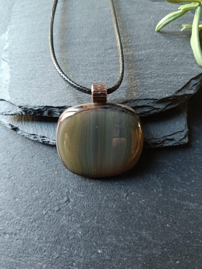 Fused glass pendant necklace with blue-green striped pendant, copper bail on black cord—artisan handmade jewellery, gift.