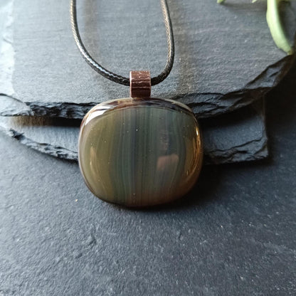 Fused glass pendant necklace with blue-green striped pendant, copper bail on black cord—artisan handmade jewellery, gift.