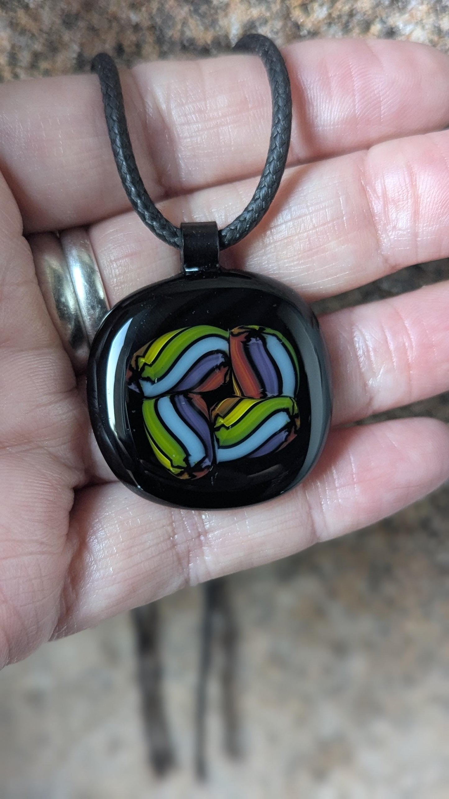 Fused glass pendant on black cord necklace; vibrant rainbow swirls, handmade one-of-a-kind letterbox gift.
