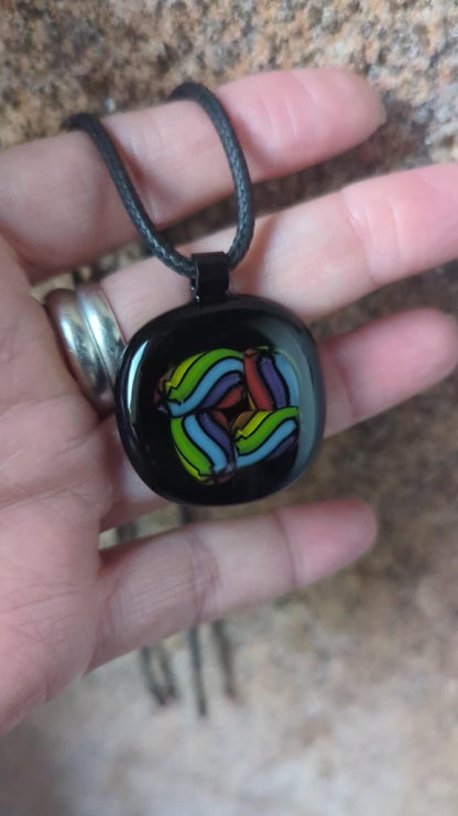 Fused glass pendant on black cord necklace; vibrant rainbow swirls, handmade one-of-a-kind letterbox gift.
