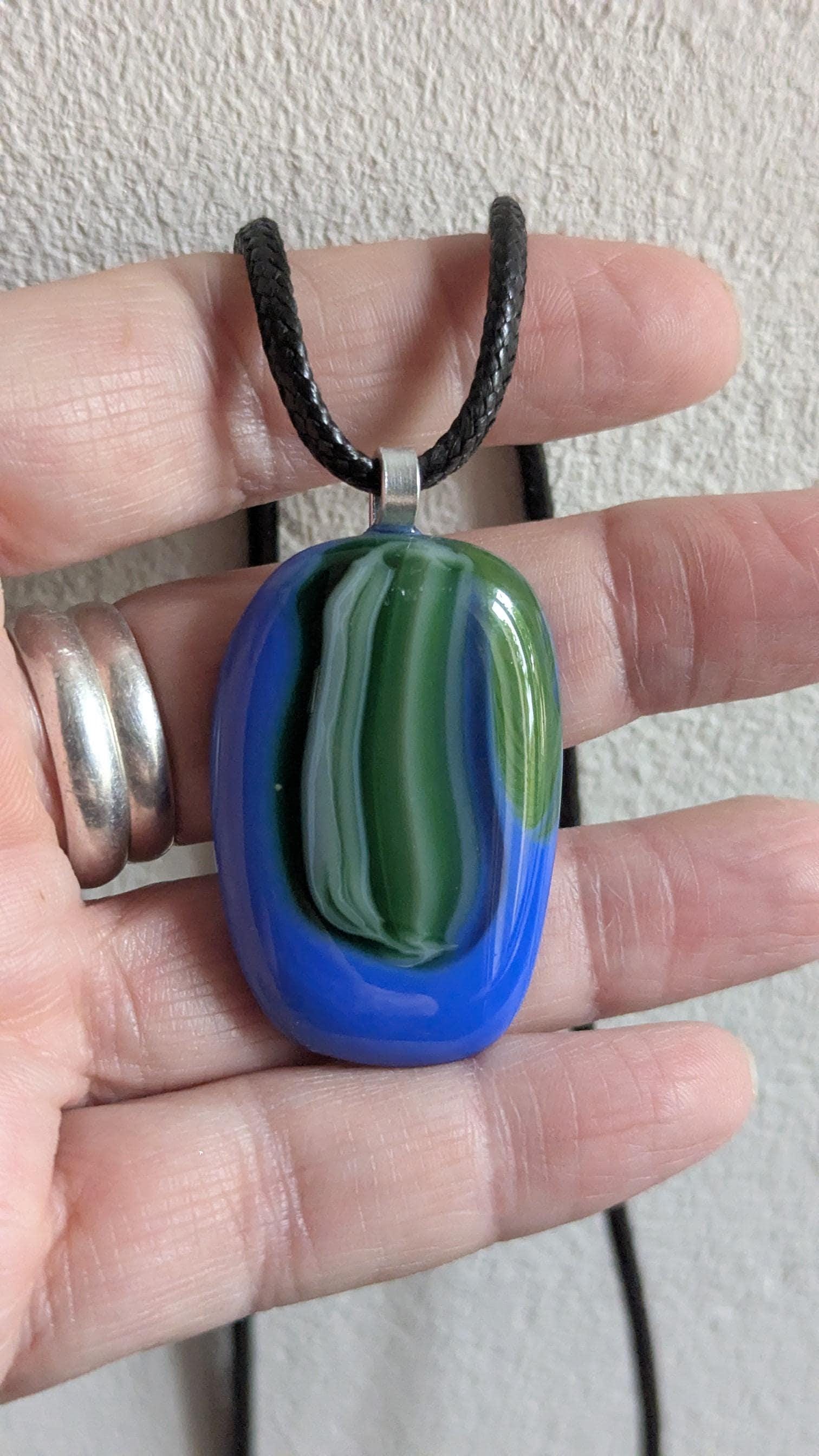 Fused glass pendant on black cord necklace; oval blue pendant with green swirls, handmade jewellery, unique one-of-a-kind.